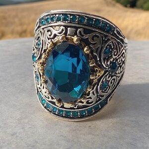Stunning Blue crystal with gold and silver accents. Size 10